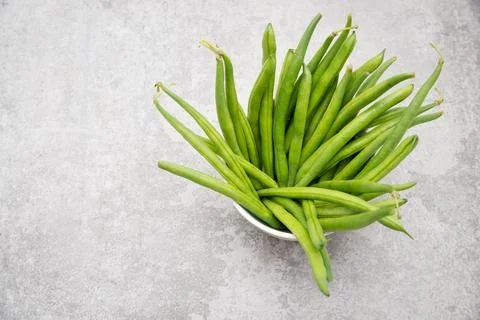 Green string beans on a  textured background, empty space for text, vegetable Stock Photos