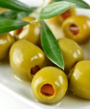 Green stuffed olives Stock Photos