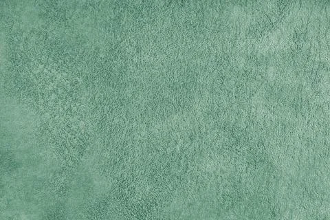 Green suede leather texture with embossed pattern background, fleecy cloth .. Fotos de archivo