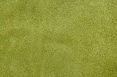 Green suede soft leather as texture background. Close up leather texture Stock Photos