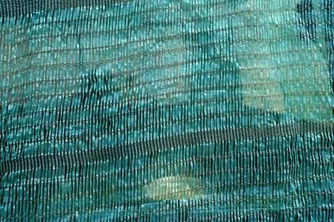 Green Sun Shade Net Texture Background. Stock Photos