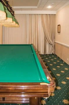 Green surface of an empty snooker table , vertical shot Stock Photos
