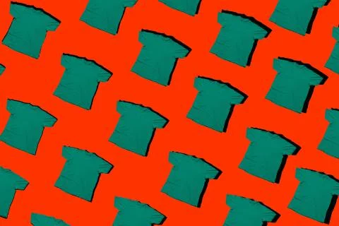 Green t shirts pattern isolated on a  red background Stock Photos