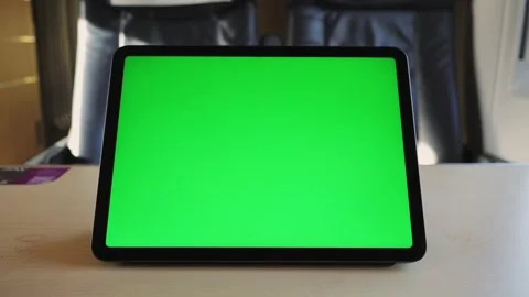 A green tablet screen close-up stands on a table in a train against the Stock Footage 301607293