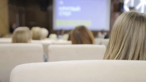 Green tablet is on a wooden table next to a laptop Stock Footage 311327813