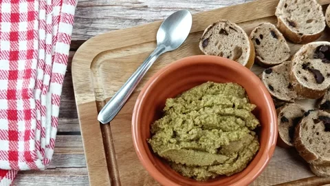 Green tapenade and olive bread toast, close-up Stock Footage 272623215