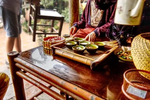 Green tea and Ginger Candy being served in a wooden house Stock Photos