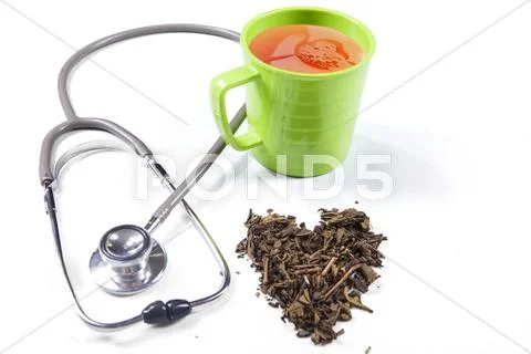 Green tea and stethoscope Stock Photos