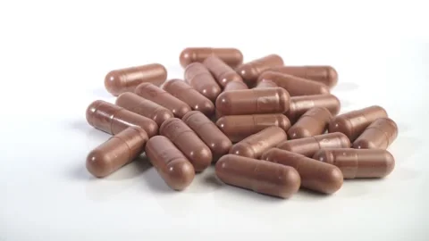 Green tea capsules isolated - EGCG supplement Stock Footage 280896313