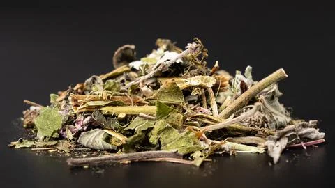 Green tea on a dark background macro close-up Stock Photos