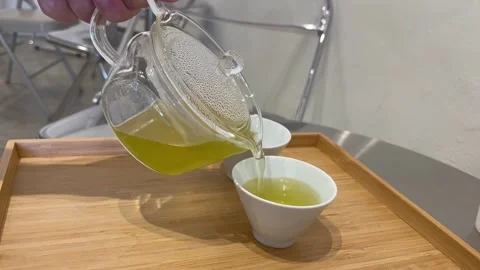 Green Tea: Fresh Brew Served in Elegant Cup Video stock 343551704