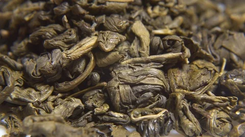 Green tea leaves rotating macro Stock Footage 123174866