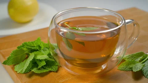 Green tea, mint and lemon are useful at any time. Stock Footage 310573168