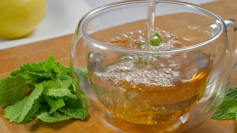 Green tea, mint and lemon are useful at any time. Stock Footage 310573199