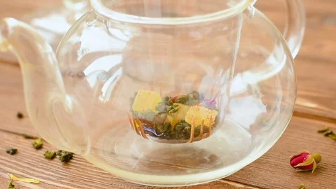 Green tea with mint, rose, goji berries and pineapple Stock Footage 73601145