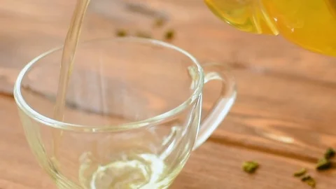 Green tea with mint, rose, goji berries and pineapple Stock Footage 73601415