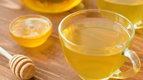 Green tea with mint, rose, goji berries, pineapple and honey Stock Footage 73603468