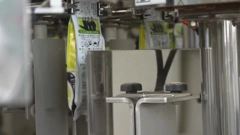 Green Tea Packaging Machine Running Printed Film Stock Footage 340009993