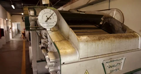 A green tea processing factory in a warehouse with machinery for drying and.. Stock Footage 330413993
