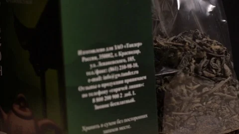 Green tea of Russian origin in the package, close-up Stock Footage 75478422