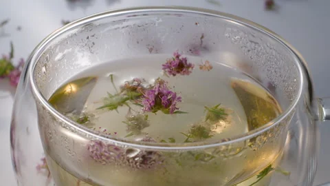 Green tea with thyme. Stock Footage 309893120