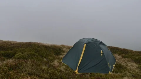 Green tent in high mountains Video stock 82037533
