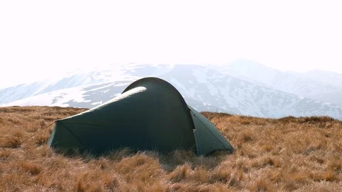 Green tent in spring mountains Stock Footage 107331025
