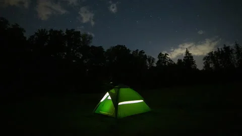 Green tent under starry sky in forest. 4k time lapse. Stock Footage 163914723