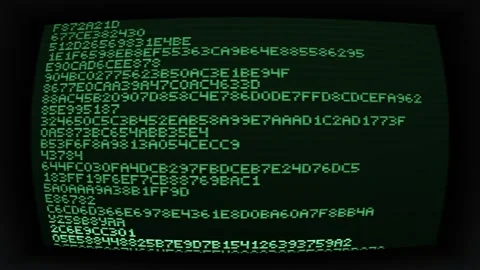 Green text on black screen showing digital code Stock Footage 340276915