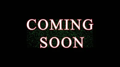 Green text COMING SOON appears on black screens with subtle light effects Video stock 345620172