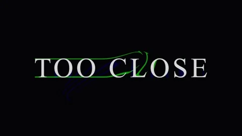 Green text TOO CLOSE with subtle glitch effect on black background Stock Footage 344285724