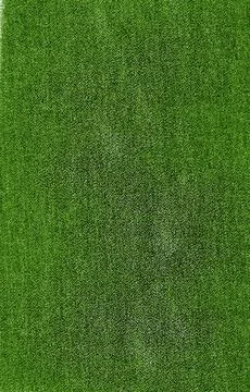 Green textile background with a rough texture Stock Photos