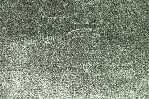 Green textured background creating visual interest with its granular pattern Illustrazione stock