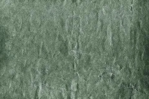Green textured background showing rough surface with cracks and scratches Stock Photos