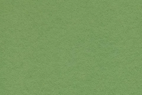 Green textured paper background with subtle grain surface and soft structure. Stock Photos