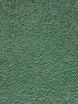 Green textured plaster wall surface background Stock Photos