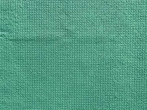 Green Textured Surface with Grid Pattern Stock Photos