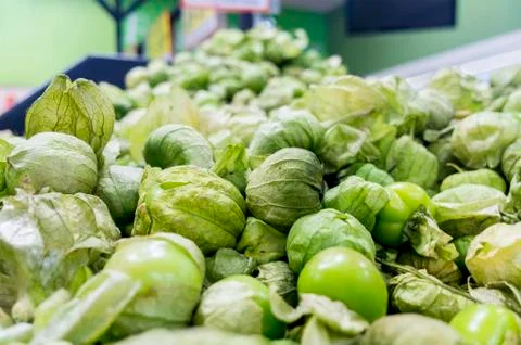 Green tomatillo background. Stock Photos