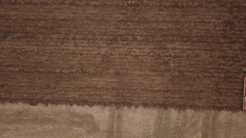 Green tractor plows the ground Stock Footage 120698503