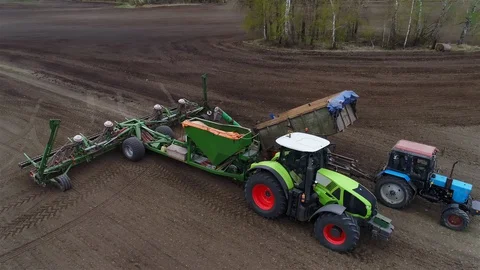 Green Tractor With Red Wheels and Sowing System, Cultivating Land, 4k Stock Footage 127979150