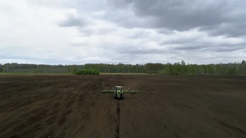 The Green Tractor With Sowing System in the Field, Aerial View Video stock 127978011