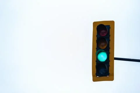 Green Traffic Light Against Solid Background 写真素材