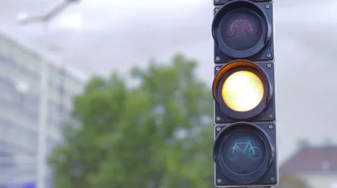 A green traffic light is changing to red Stock Footage 56937984