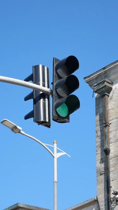Green traffic light at a city intersection in daytime Stock Footage 341221455