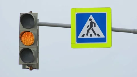 The green traffic light flashes against a clear sky and then changes Stock Footage 278545796