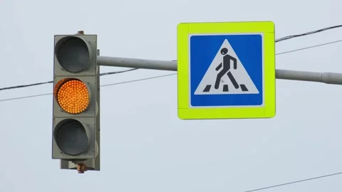 The green traffic light flashes against the sky and wires and then changes Stock Footage 278545825