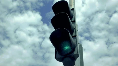 Green traffic light in overcast sky and clouds. Stock Footage 53814402