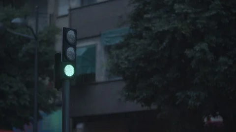 Green traffic light under the rain Stock Footage 124620356