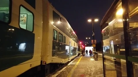 Green Train at Station as People rush to enter Stock Footage 102751655