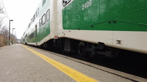 Green Train stopping at train station Stock Footage 102897169